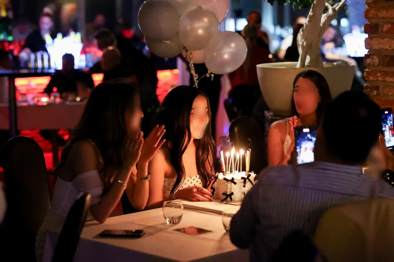A birthday celebration with cake and candles at 360 Istanbul